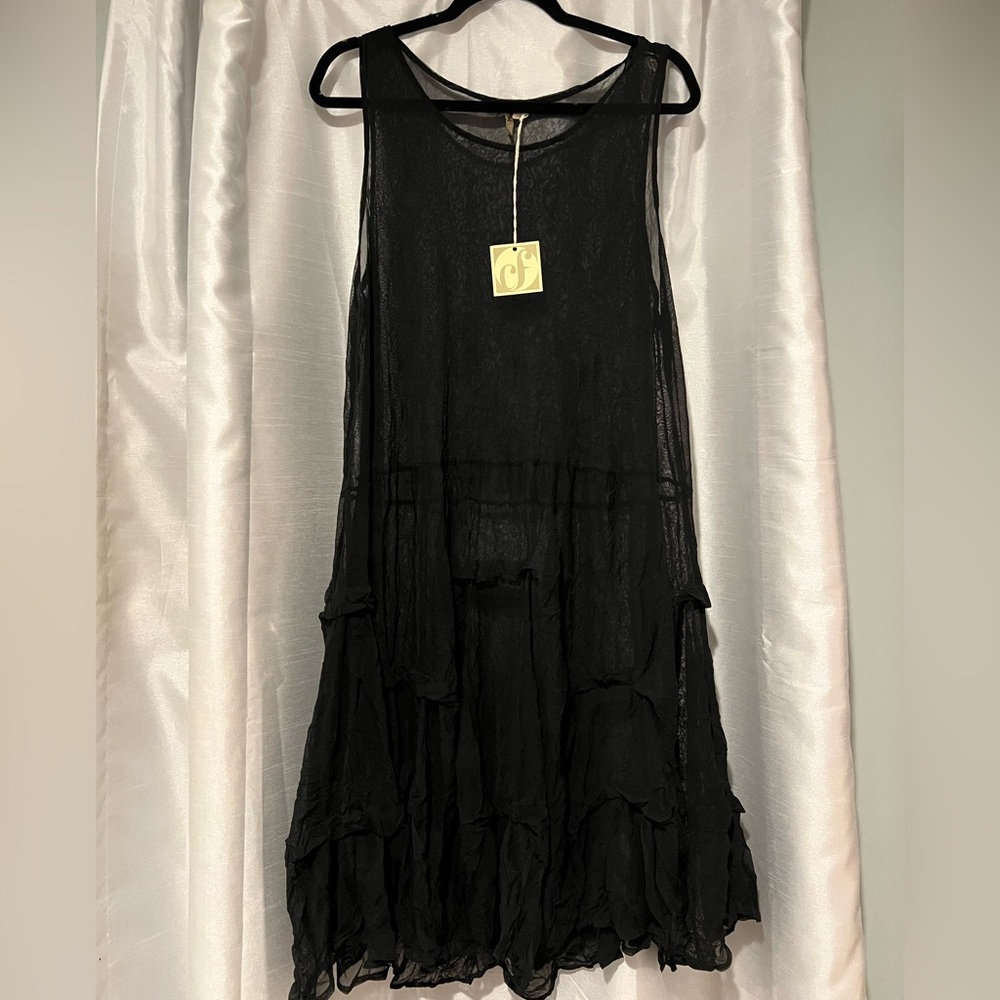Sheer sleeveless duster. Good for beach cover up or overlay over another outfit
